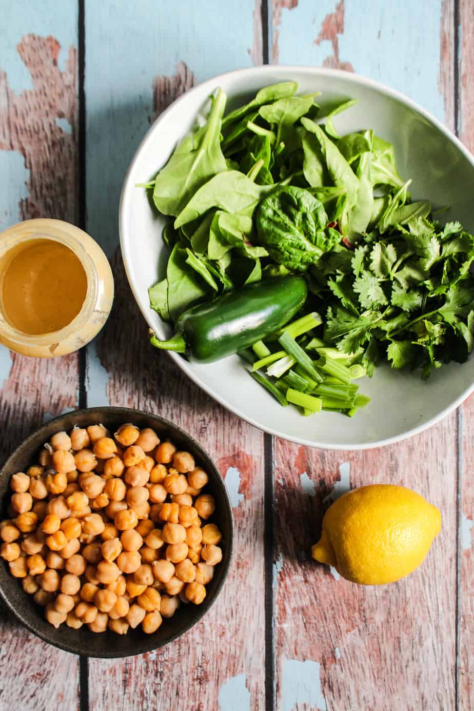 ingredients: spinach, green herbs, green onions, jalapeño, lemon, chickpeas, tahini