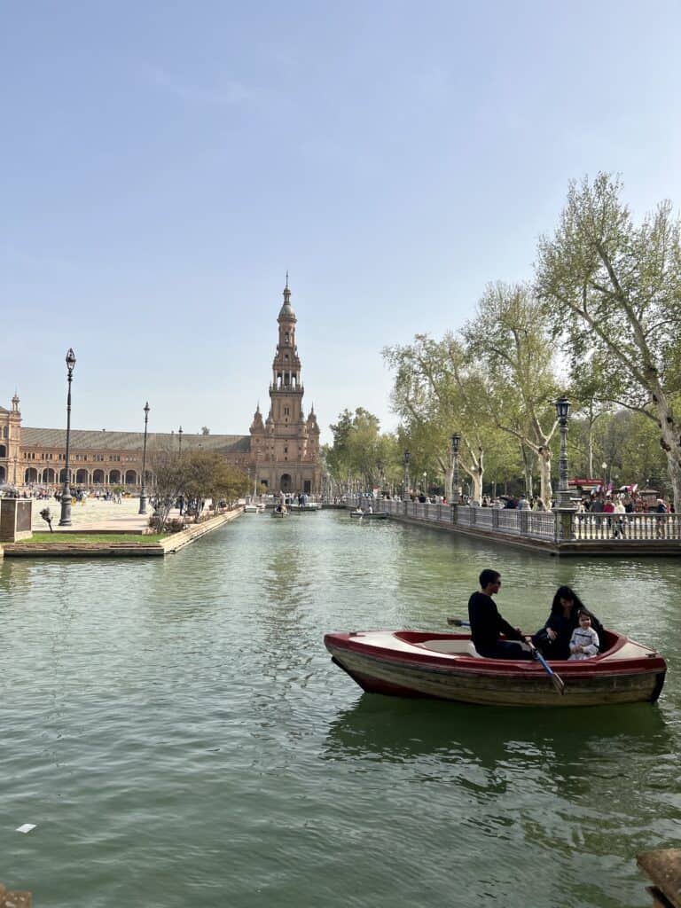 water way at the plaza de espana with one boat passing through