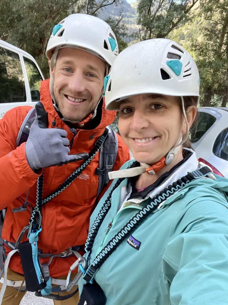 Zac and Caitlin wearing harnesses and helmets.