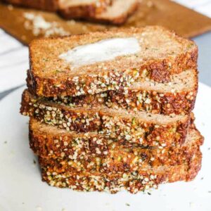 Stack of low sugar zucchini bread on a plate.