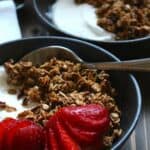 best homemade granola in a bowl with yogurt and fruit