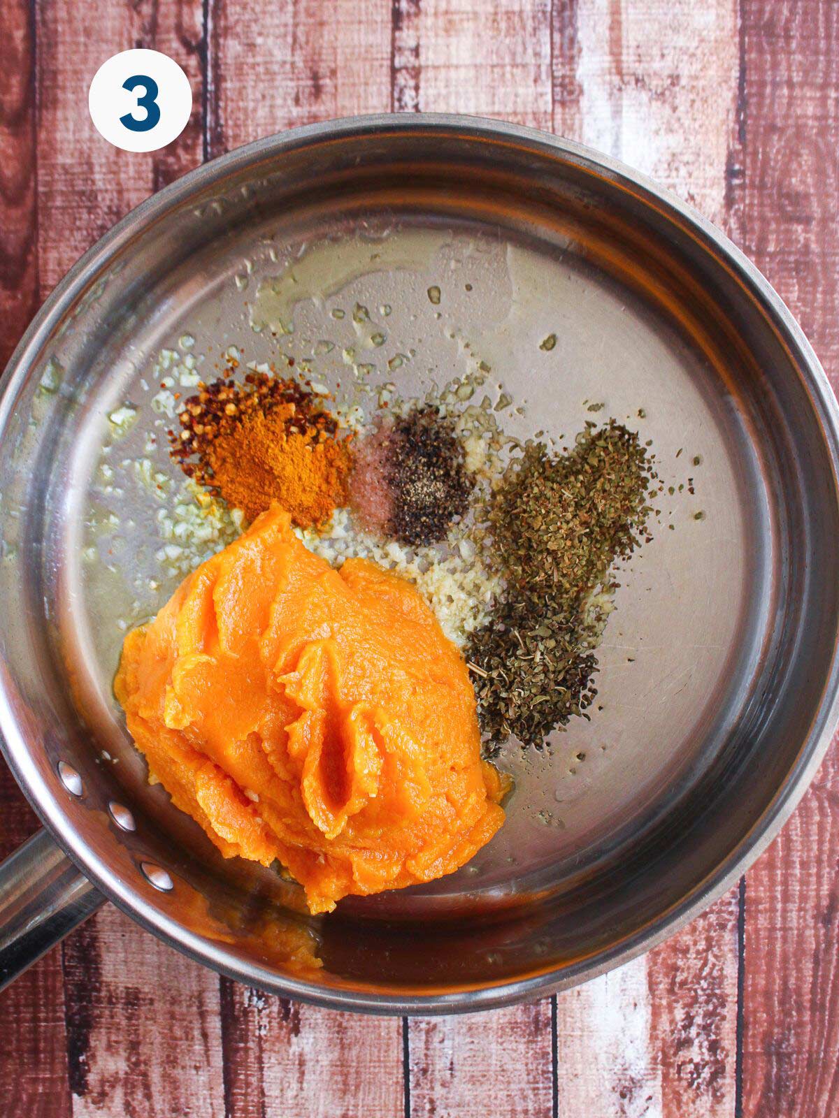 Pumpkin puree and ingredients added to make pumpkin pasta sauce.