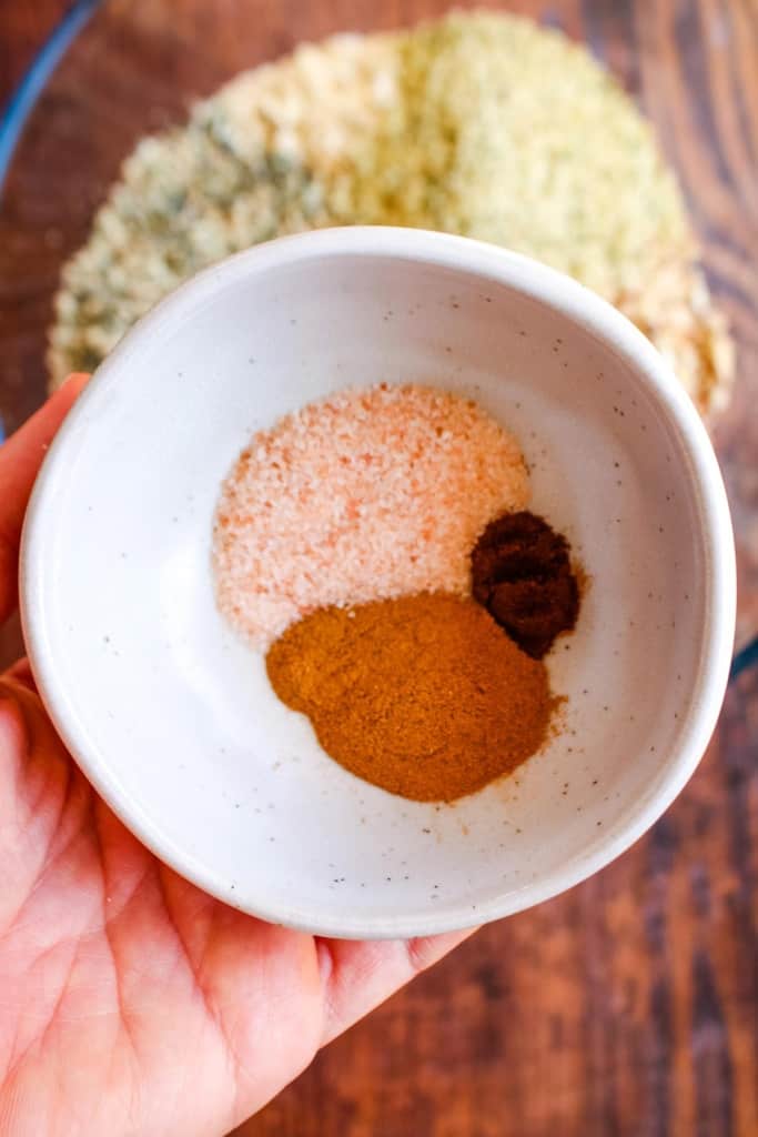 The spices in a bowl to add to the granola mixture.