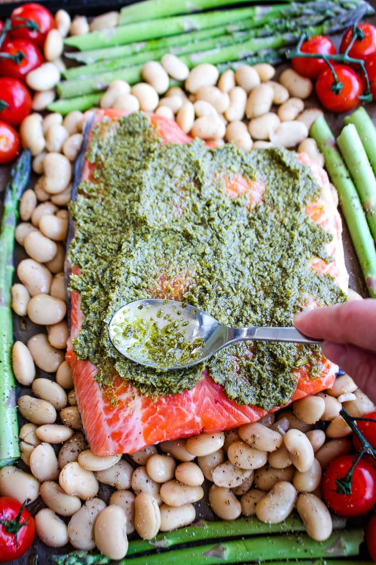 Pesto spread over the top of the salmon.