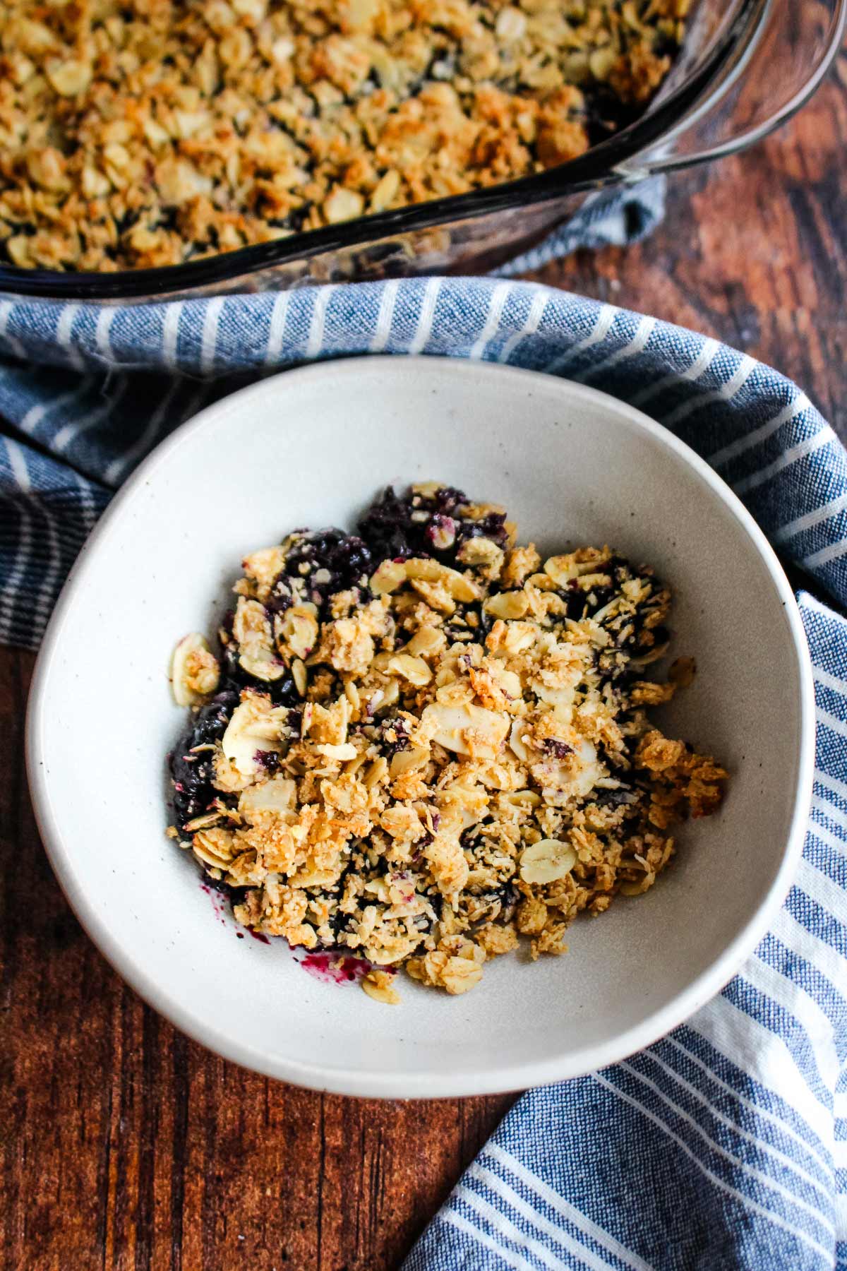 Blueberry crisp made gluten-free served in a bowl.