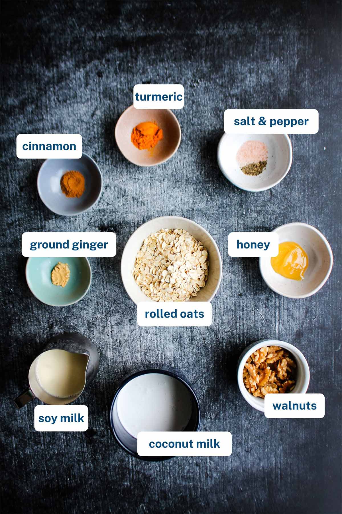 Ingredients to make golden milk oatmeal on the table with text labels.