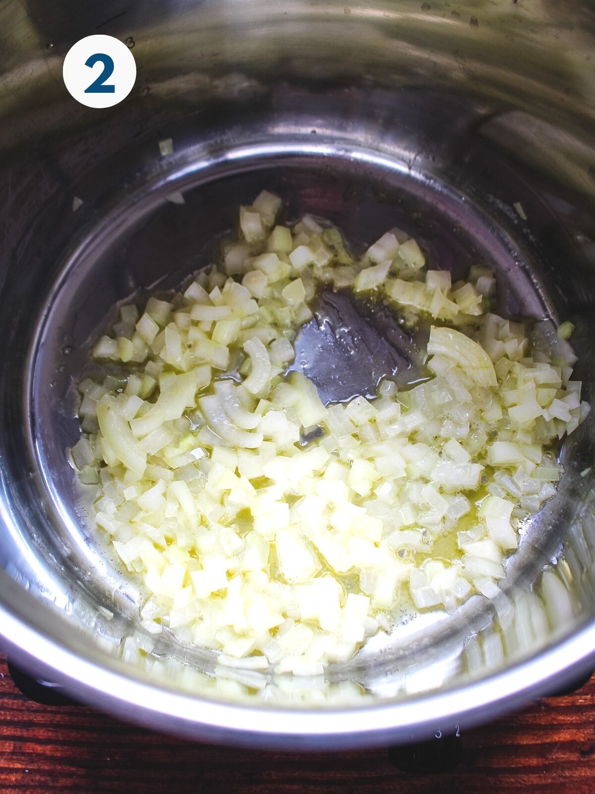 Onions cooking in a pot.