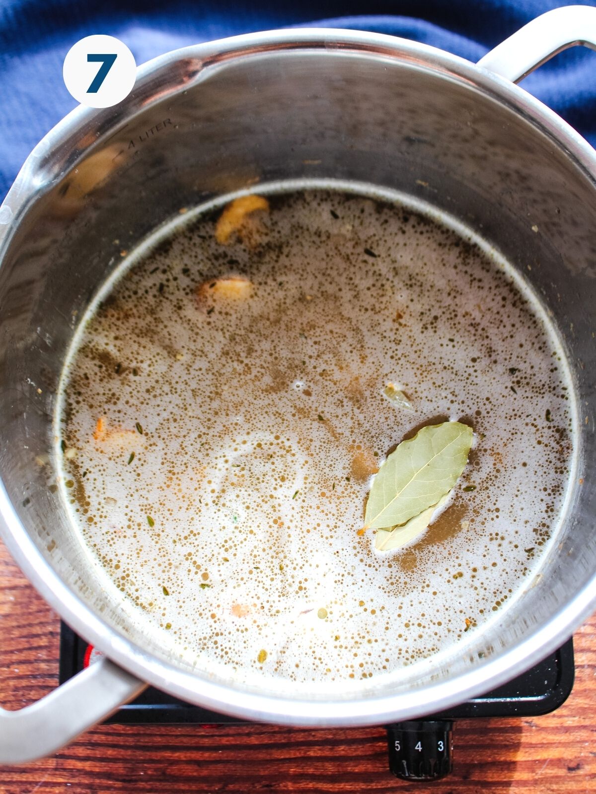 Broth added to the pot with the mushrooms.