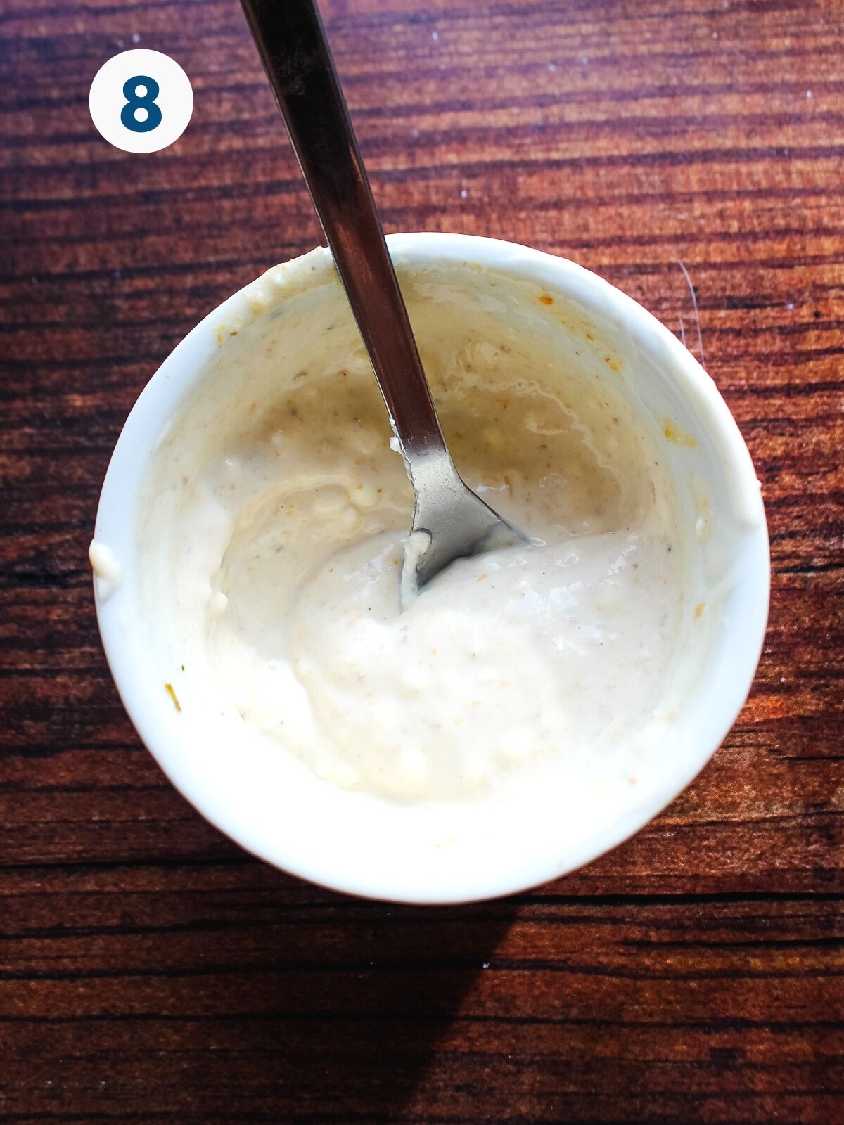 Cream cheese mixed in a bowl on the table.