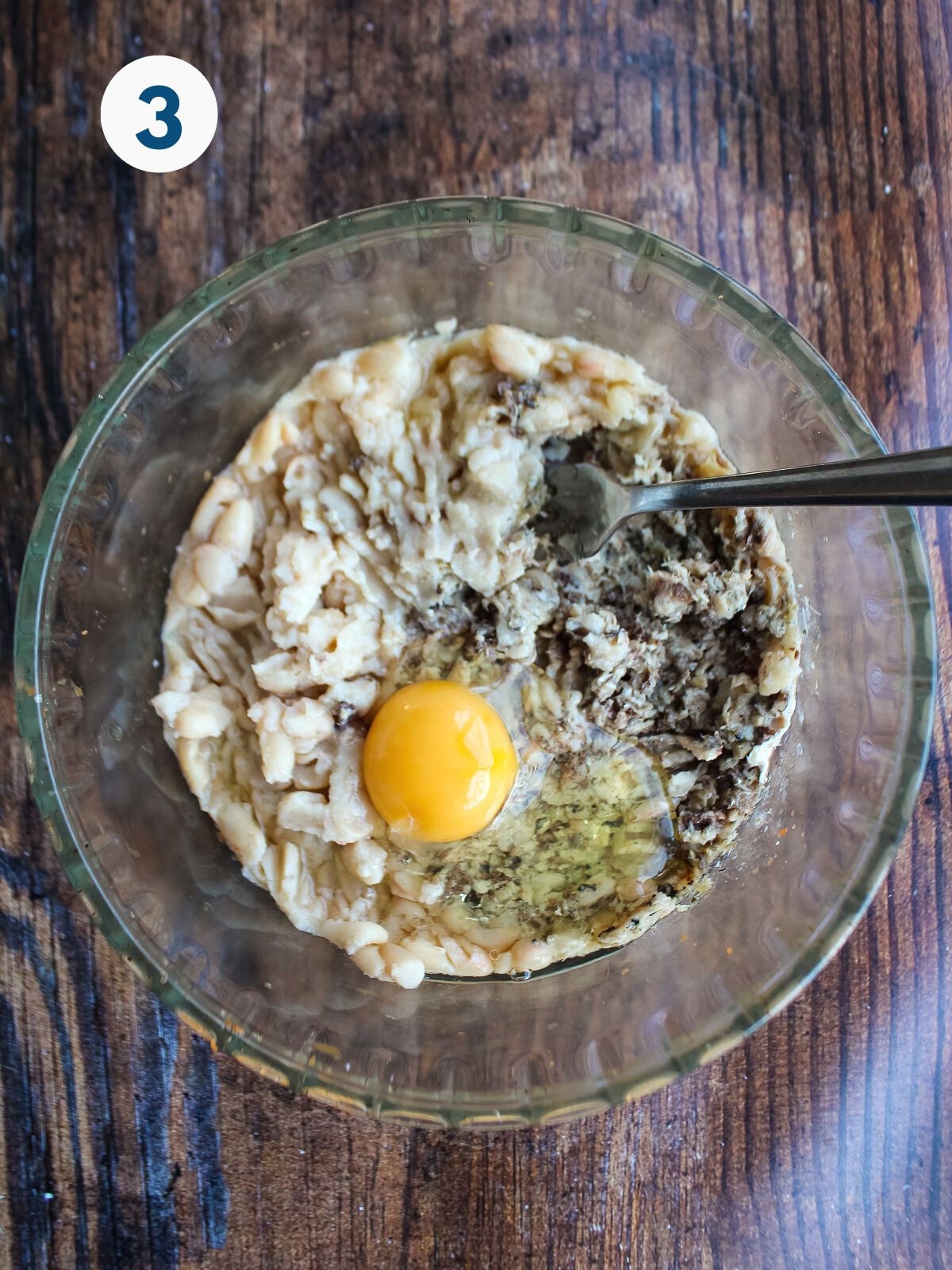 An egg added to the sardine and cannellini bean mixture.