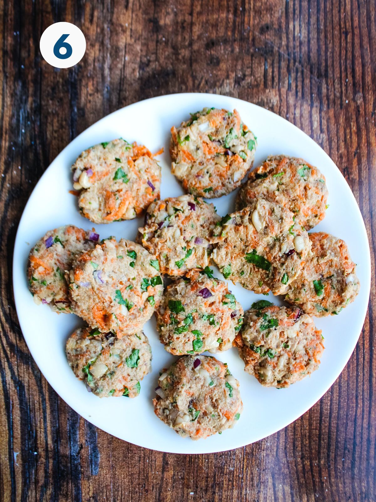 Sardine cakes shaped on a plate.