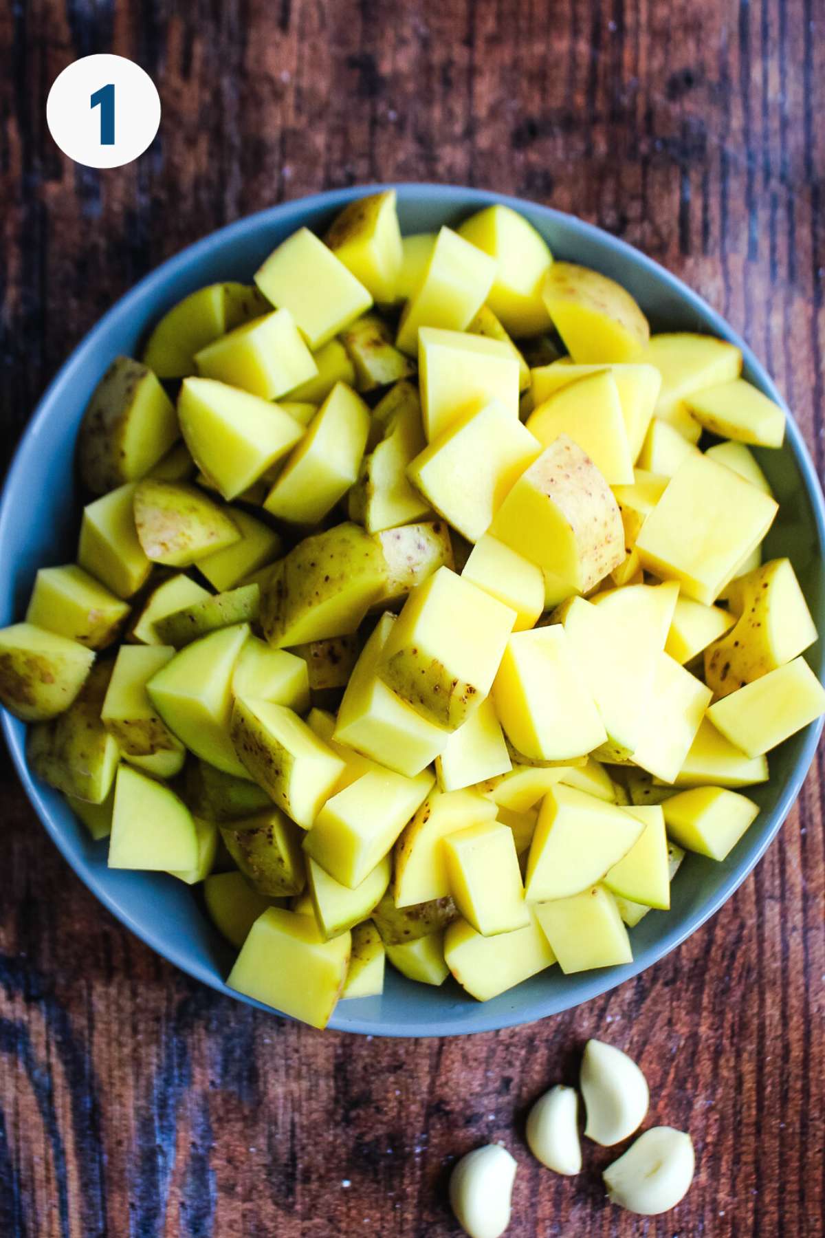 Potatoes cut in a bowl on the counter.