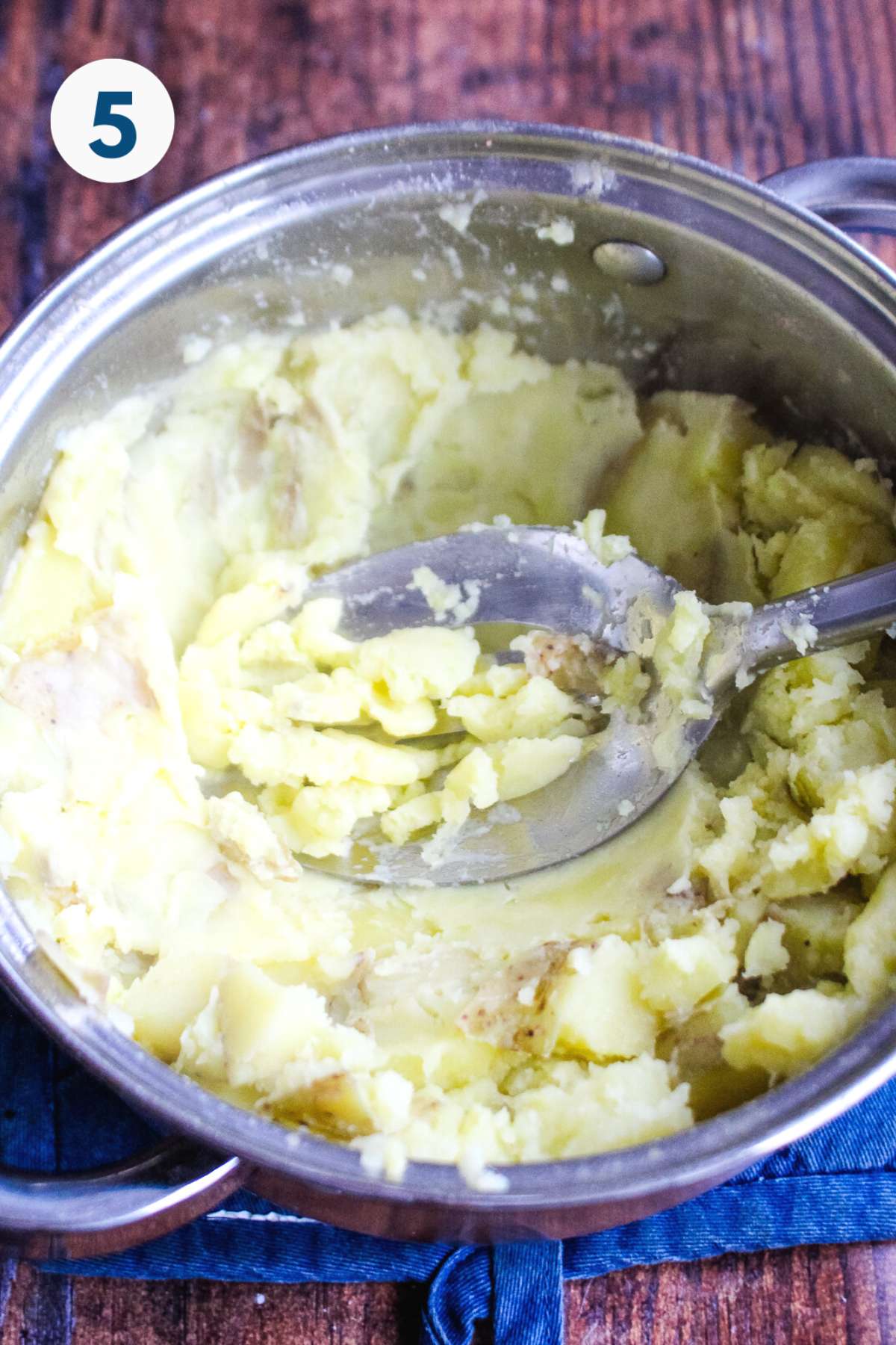 Mashed potatoes in a pot after mixing.