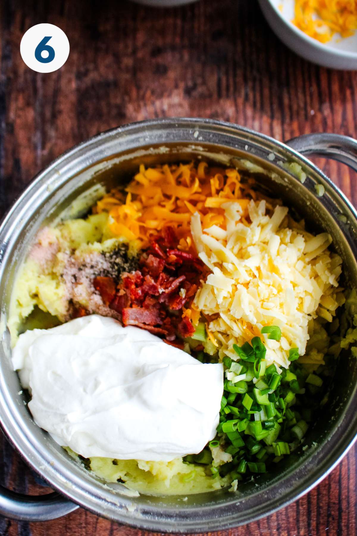 All the ingredients added to the pot to make twice baked mash potatoes.