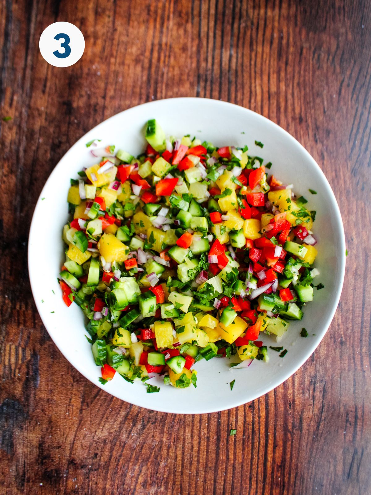 Pineapple salsa mixed in a bowl.