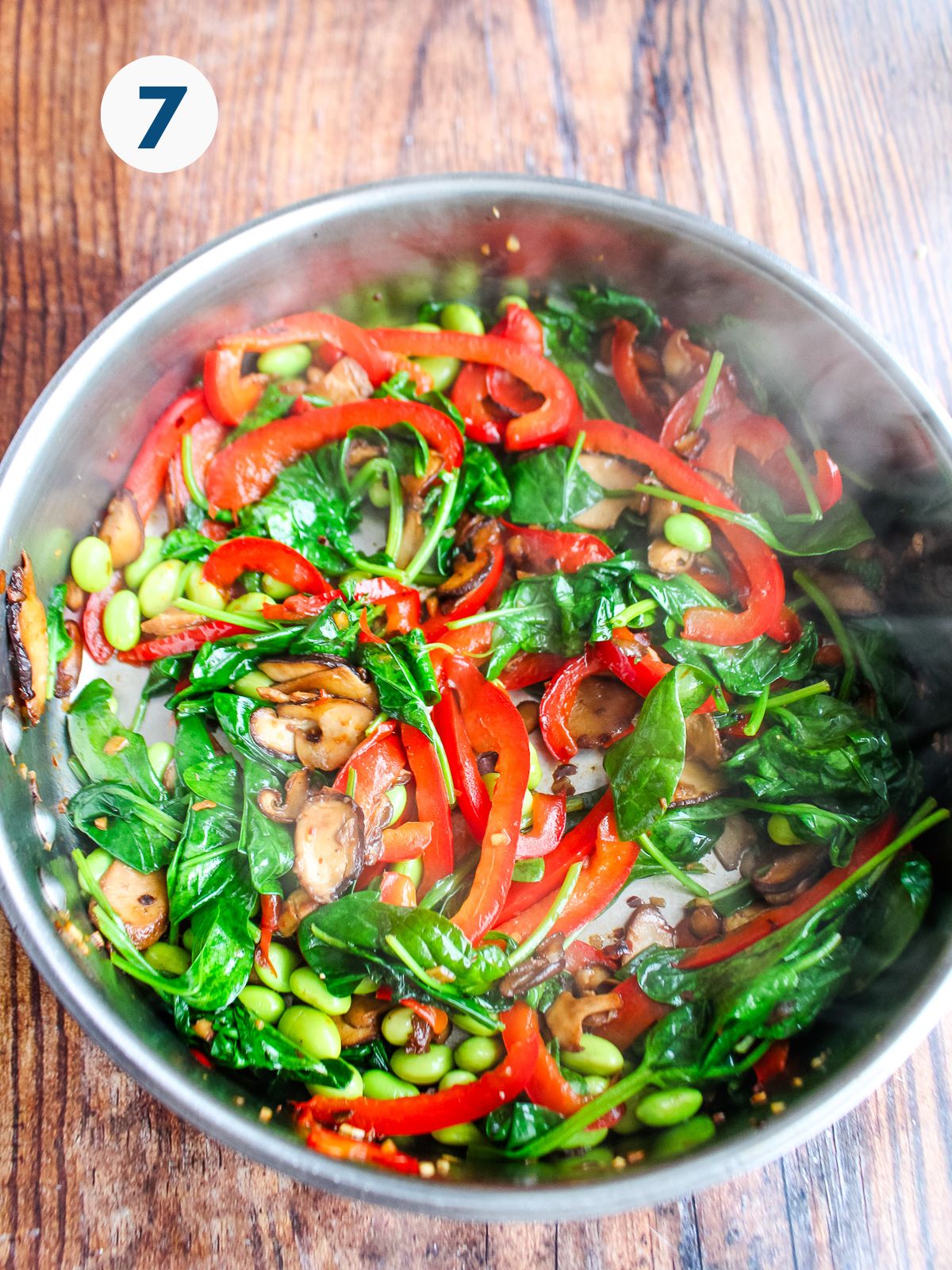 Cooked vegetables in a skillet.