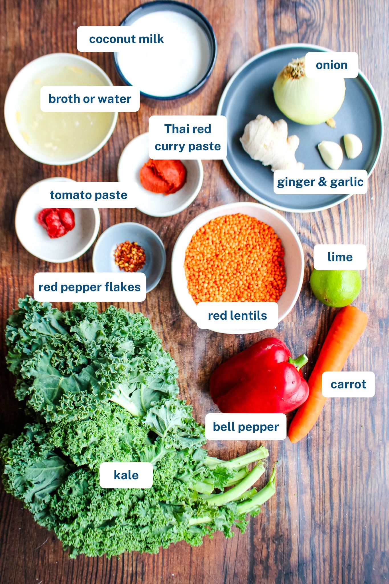 Red lentil stew ingredients on the table with text labels before cooking.