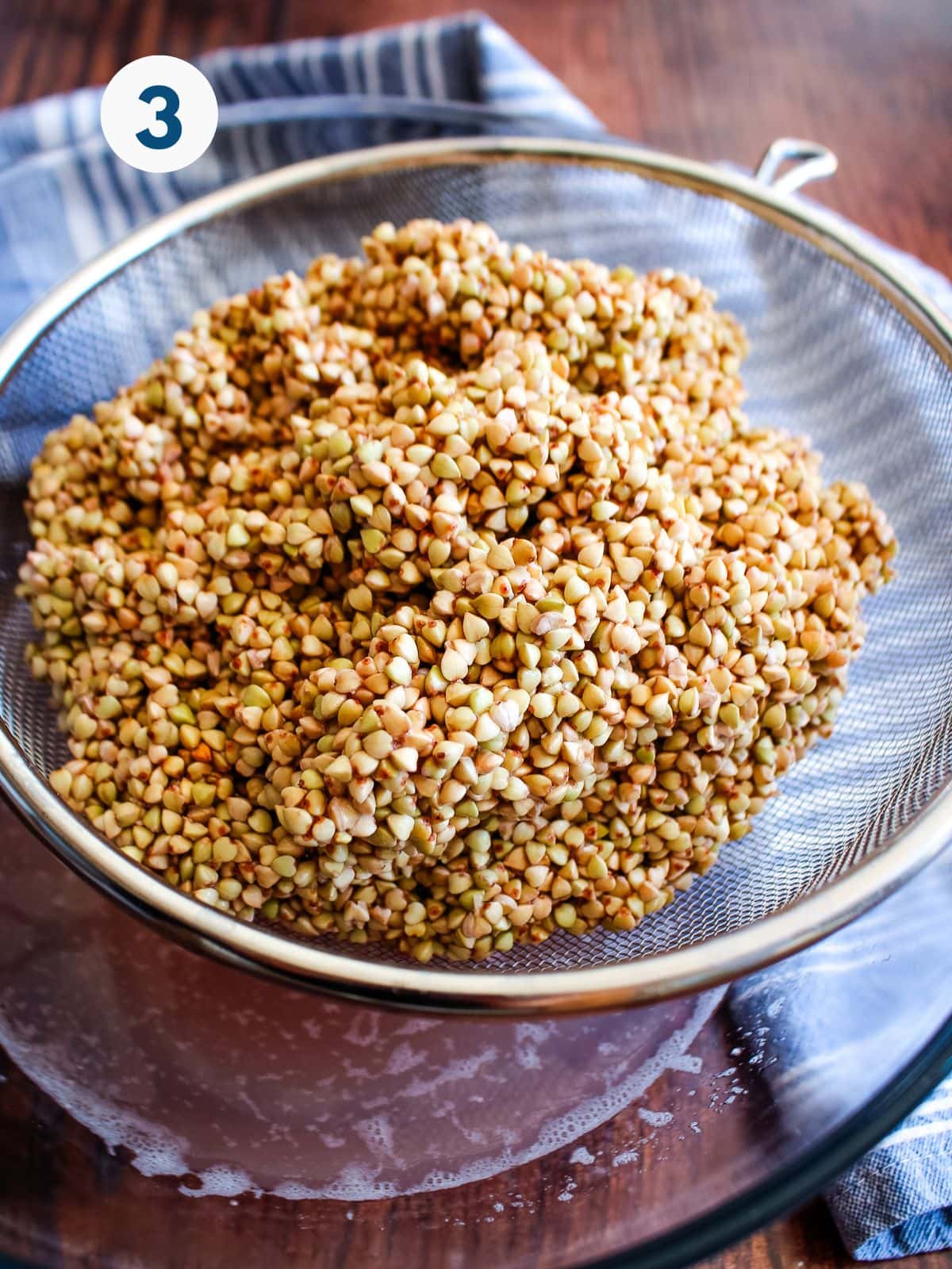 Soaked buckwheat in a colander.