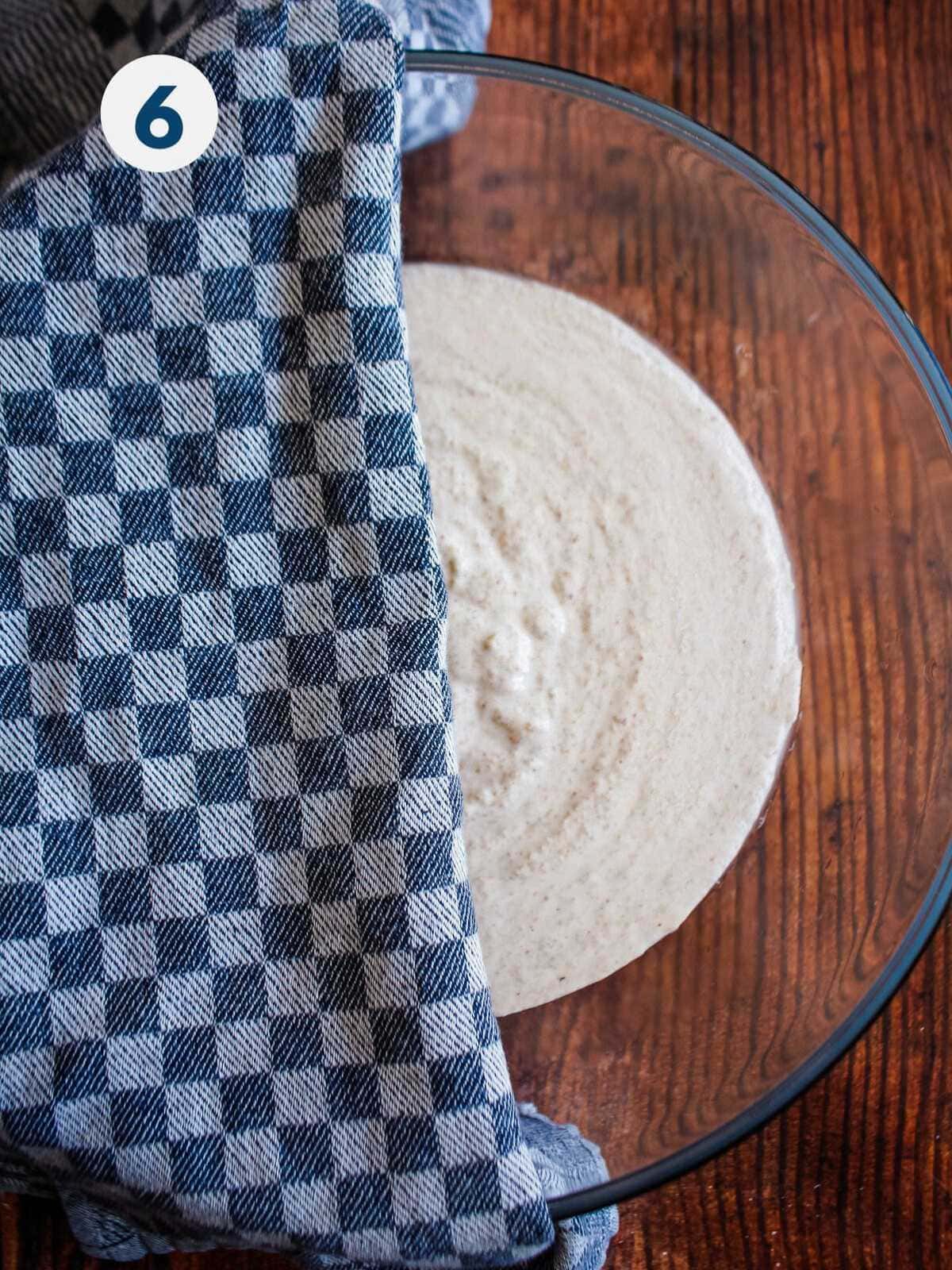 Covering the buckwheat dough with a towel.