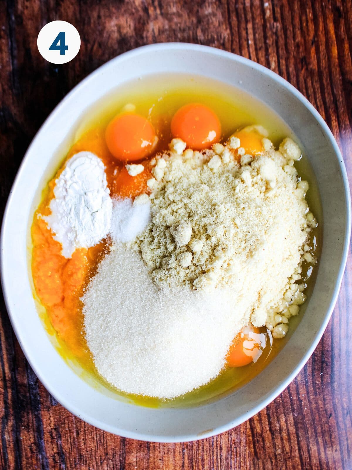 Ingredients to make clementine cake in a bowl.