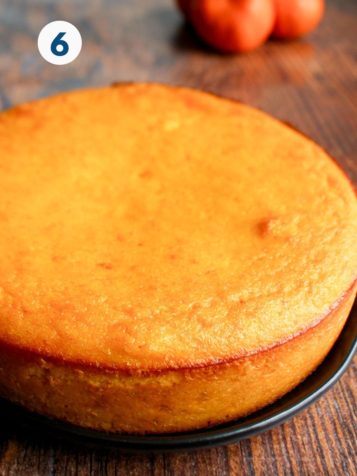 Cooked clementine cake on a platter.