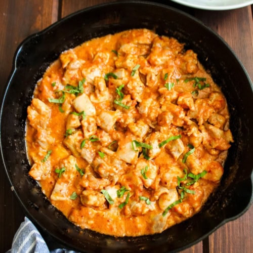 Chicken cooked in cottage cheese sauce with tomatoes.
